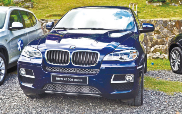 UPLAND RIDE. This X6 30d, known as the pioneer of the Sports Activity Coupe concept, was one of the five BMW X models taken for a test run on the winding roads of Busay.