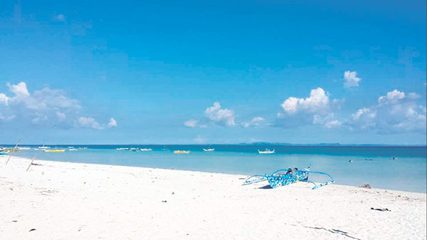 BEACHES. One of the best ways to enjoy Sta. Fe is frolicking in its pristine white beaches. (Photo by Freon L. Ollival)