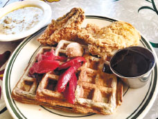 Chicken and Waffles (two pieces Chicken, buckwheat waffles topped with cinnamon butter and sour cherry poached pears)