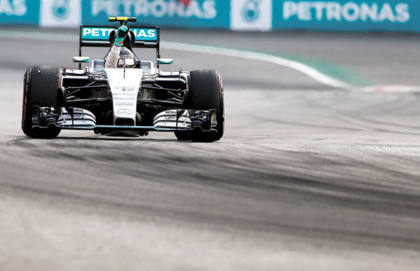 F1 IN MEXICO. Mercedes driver Nico Rosberg, from Germany, celebrates as he crosses the finish line during the Formula One Mexico Grand Prix auto race at the Hermanos Rodriguez racetrack in Mexico City. Nico Rosberg won the first Mexican Grand Prix since 1992 on Sunday, Nov. 1, for his fourth victory this season, denying Mercedes teammate Lewis Hamilton in his bid to tie the Formula One record of 13 victories in a season. Hamilton came second. (AP PHOTO)