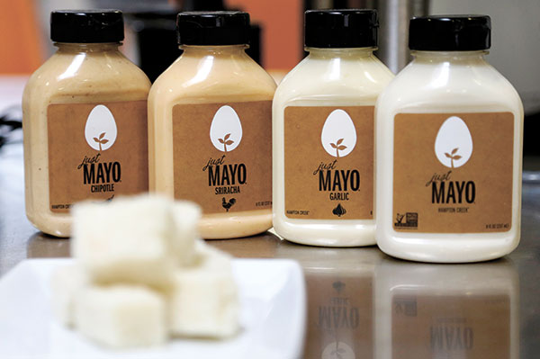 SIMPLE RULE. Hampton Creek Foods bottles of Just Mayo flavors at their office in San Francisco. Hampton Creek’s mission is to replace the eggs in products without anyone noticing. In trying to appeal to the mainstream, co-founder and CEO Josh Tetrick has a simple rule. “Number one, never use the word ‘vegan,’” he said. (AP PHOTO)