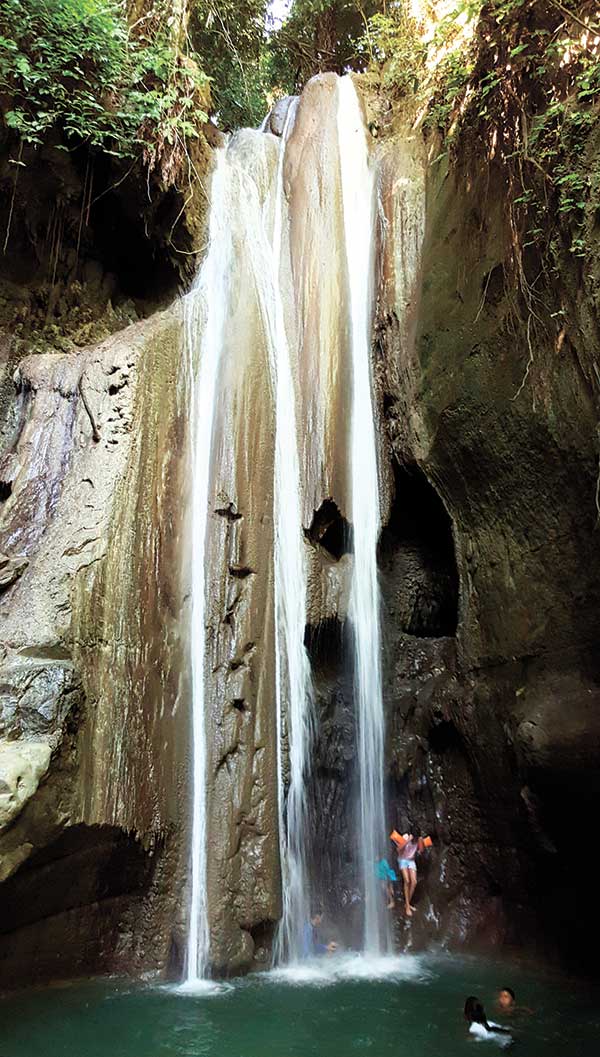 BINALAYAN OR HIDDEN FALLS. (Left) Binalayan is also called the Hidden Falls as it suddenly reveals itself following a short hike through the forest along a stream. Others call it the Triple Drop Falls. The path leading to the falls and the rock faces are made of smooth limestone.