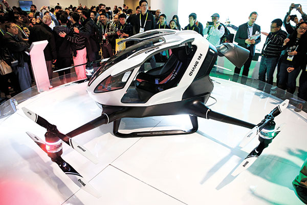ONE BIG DRONE. People crowd around the EHang 184 autonomous aerial vehicle at the EHang booth at CES International gadget show in Las Vegas. The drone is large enough to fit a human passenger. (AP PHOTO)
