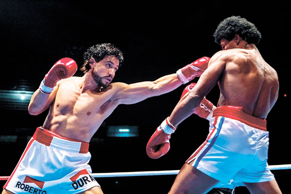 This image released by The Weinstein Company shows Edgar Ramirez (left) and Usher Raymond in a scene from “Hands of Stone.” (The Weinstein Company via AP)