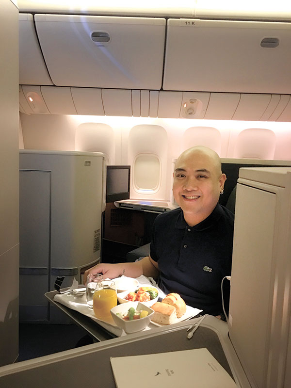 Enjoying the comfort, delicious food, and impeccable service at Cathay Pacific’s Business Class.